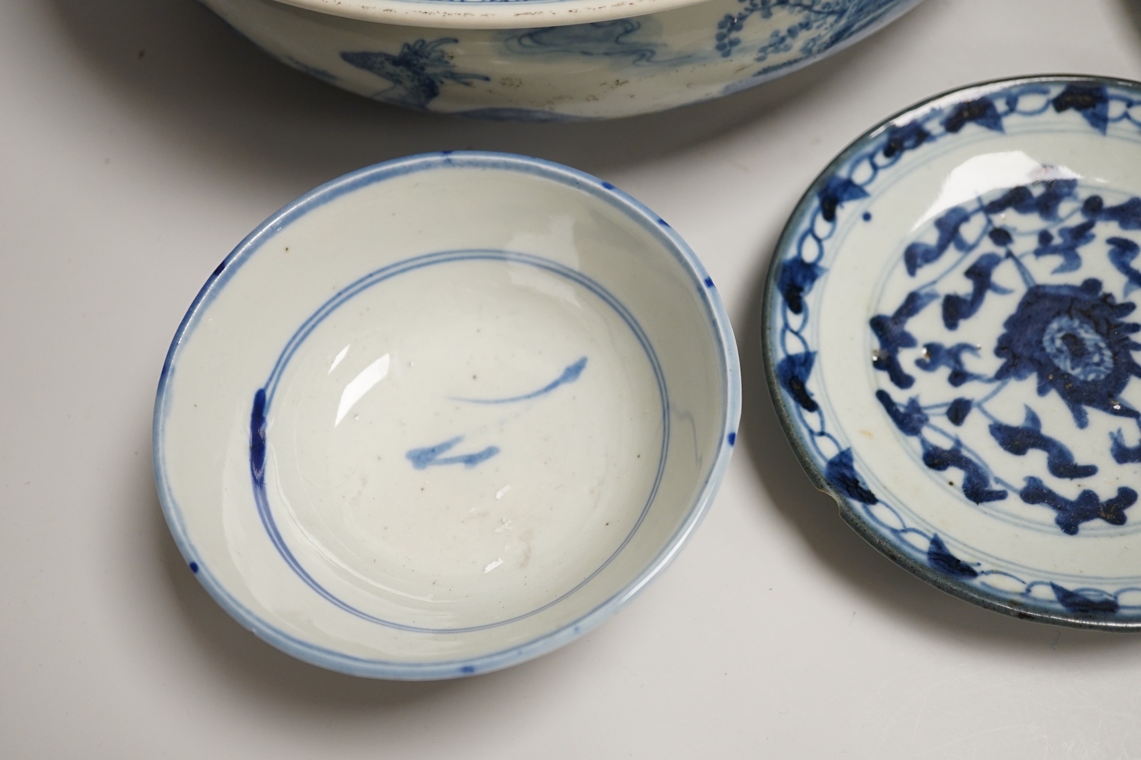 A Chinese blue and white bowl, tea bowl and saucer, and two other dishes, largest 29cm diameter